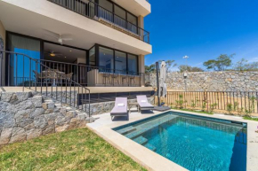 Private and heated POOL with ARCH VIEW new condo!